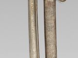 two knives that are attached to each other