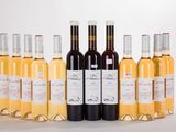 six bottles of wine sitting next to each other on a table