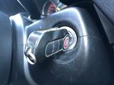 a close up of a steering control in a car
