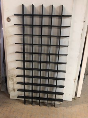 a picture of a rack with a bunch of knives on it