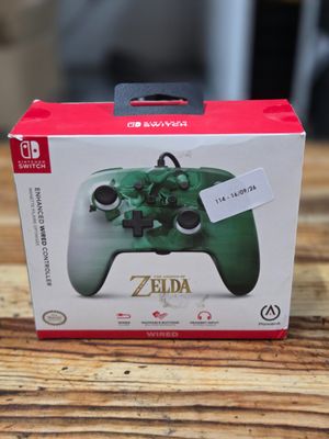 the box of the nintendo wii controller is sitting on a wooden table