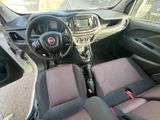 the interior of a small car with a steering wheel and dashboard