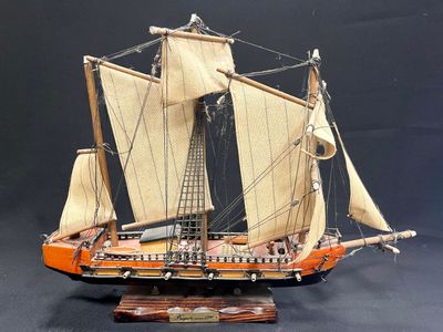 a model of a sailing ship on display on a table