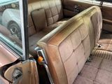 a dirty car with the door open and the seat up