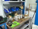 a workbench with many items on it in a garage