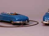two toy cars that are connected to each other