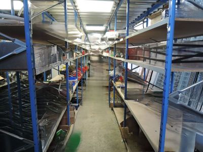 many shelves in the store with many items on them
