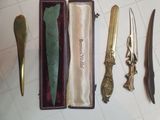five different types of knives in a box on a table