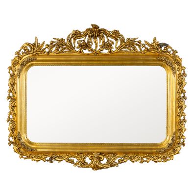 un miroir encadré d'or sur un mur blanc avec un fond blanc
