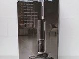 an image of a box of a vacuum cleaner on a white surface