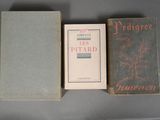three books sitting on top of a table next to each other