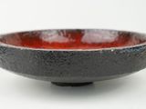 black and red bowl on white background with white background