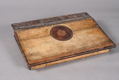 a small wooden box that has a picture on it