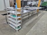 a long table with several shelves on it in a room