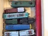a box full of different types of toy trains in it