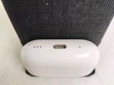 a small white device sitting on top of a black bag