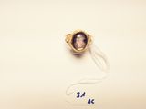 a picture of a ring with a picture of a man on it