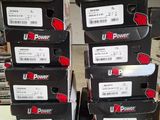 several boxes of up power products are stacked on top of each other