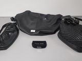 a black purse and a cell phone sitting on a table
