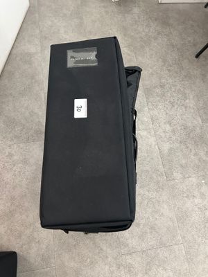 a piece of luggage sitting on the floor next to a chair