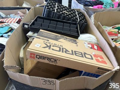 many boxes of assorted items sitting in a pile