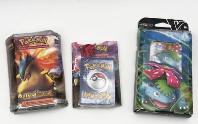 three packs of pokemon cards on a white surface