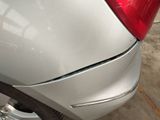 a close up of a car that has a dent in it