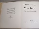 an open book on a table with a picture of a shakespeare play