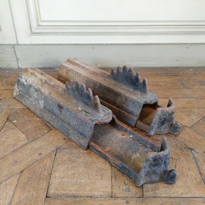 two pieces of wood sitting on the floor next to each other