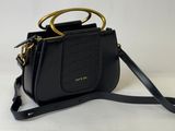 a black handbag with a gold handle on a white background