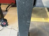 an image of a black speaker in a room