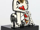statue of a dog with a crown on top of it ' s head