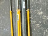 four poles that are sitting next to each other on the floor