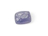 a close up of a purple stone on a white surface