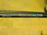 two fishing rods sitting next to each other on a yellow surface