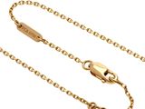 a close up of a gold chain on a white background