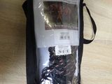 a bag with a bunch of items in it on a table