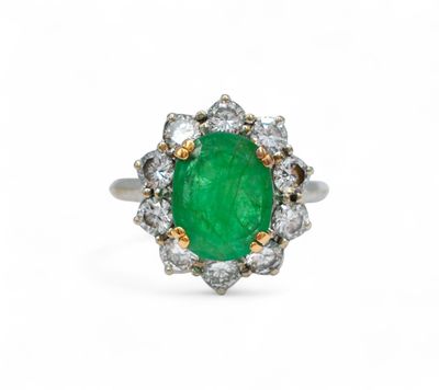 an oval emerald and diamond ring