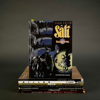 books stacked on top of each other on a black surface