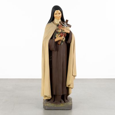 a statue of a woman holding a bird in her hands