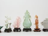 six jade and jade figurines of various shapes and sizes