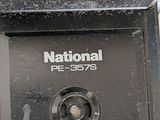 a close up of a parking meter with the national logo on it