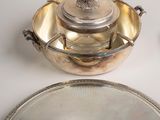 a silver plate with a silver lid and a silver plate with a silver lid