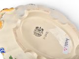 a white plate with a floral design on it
