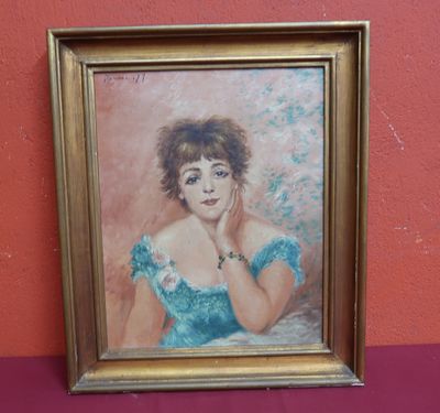 painting of a woman in a blue dress in a gold frame