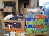 a pile of boxes and boxes of clothing on the floor