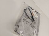 a bag of clothing sitting on a table with a tag on it