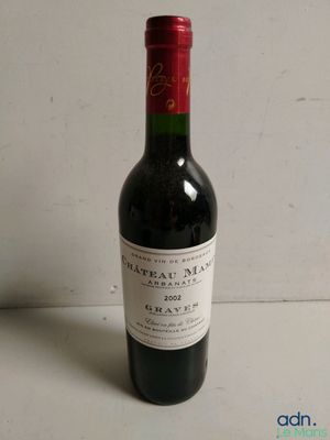a bottle of wine that is sitting on a table