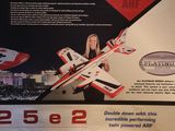 a picture of a woman holding a remote control plane