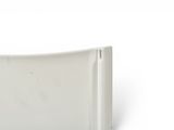 underside view of a toilet seat showing the back of the seat